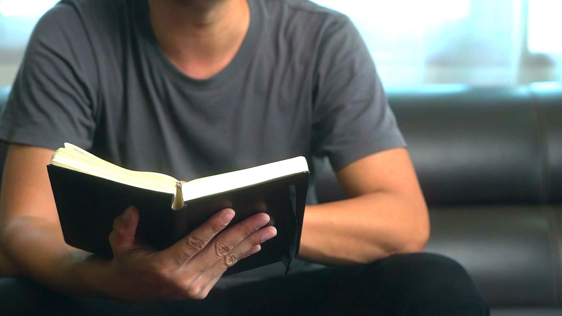 Students working on financial analysis with calculators and charts spread across a table