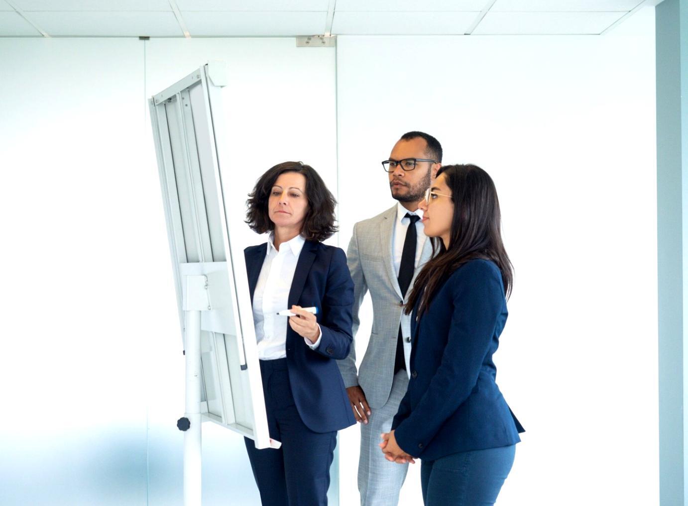 Students working collaboratively on budget analysis case studies